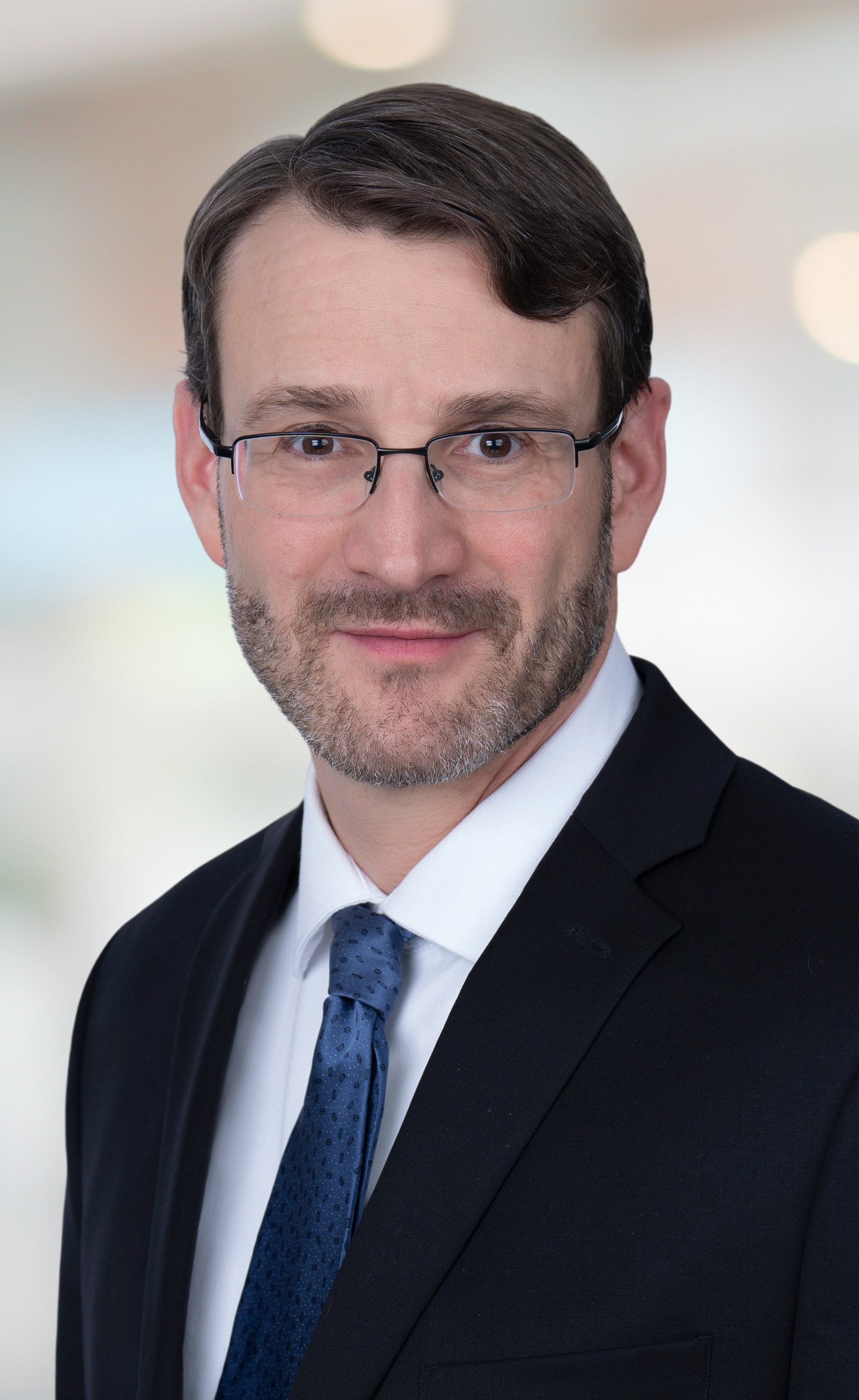 Brian Markovitz, Principal in the Labor and Employment Practice at Joseph, Greenwald & Laake, P.A seen posing for a photo in white shirt and black color suit